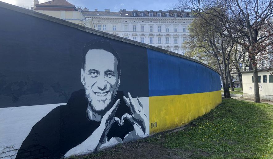 A picture of Alexei Navalny on a mural in Vienna, Austria, Wednesday, March 27, 2024. Two large portraits of the late Russian opposition leader Alexei Navalny have been spray-painted on a property owned by the family of a former Czech foreign minister behind a monument to Soviet soldiers in Vienna. (AP Photo/Philipp-Moritz Jenne)
