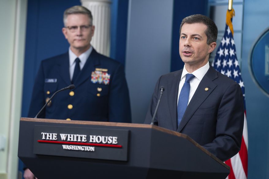 Coast Guard Deputy Commandant for Operations Vice Admiral Peter Gautier listens as Transportation Secretary Pete Buttigieg speaks about the Francis Scott Key bridge collapse during a press briefing at the White House, Wednesday, March 27, 2024, in Washington. (AP Photo/Evan Vucci) ** FILE **