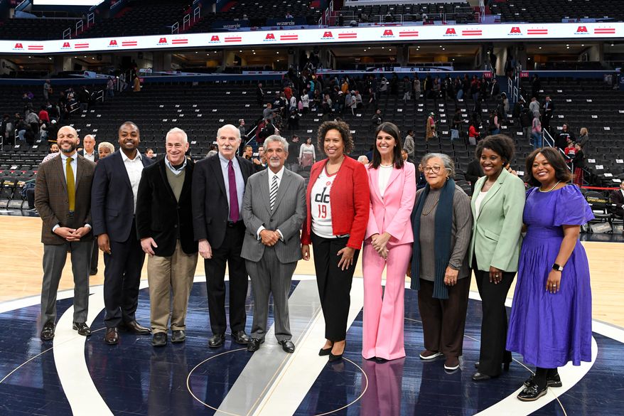 Monumental Sports & Entertainment chief executive Ted Leonsis with D.C. Mayor Muriel E. Bowser and members of the D.C. City Council before signing an agreement that would keep the Wizards and Capitals at Capital One Arena in Washington D.C. until 2050, March 27, 2024. (Photo by Jack Sabatini)