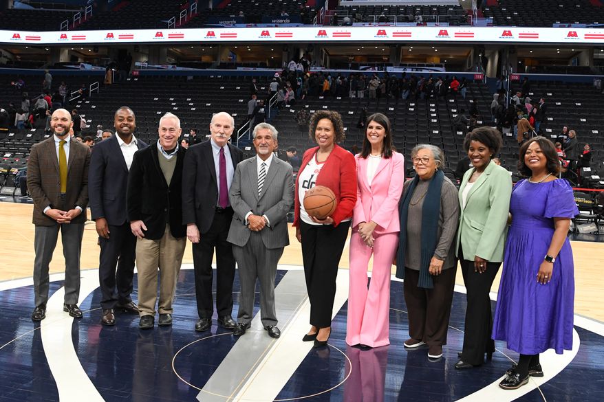 Monumental Sports & Entertainment chief executive Ted Leonsis with D.C. Mayor Muriel E. Bowser and members of the D.C. City Council before signing an agreement that would keep the Wizards and Capitals at Capital One Arena in Washington D.C. until 2050, March 27, 2024. (Photo by Jack Sabatini)