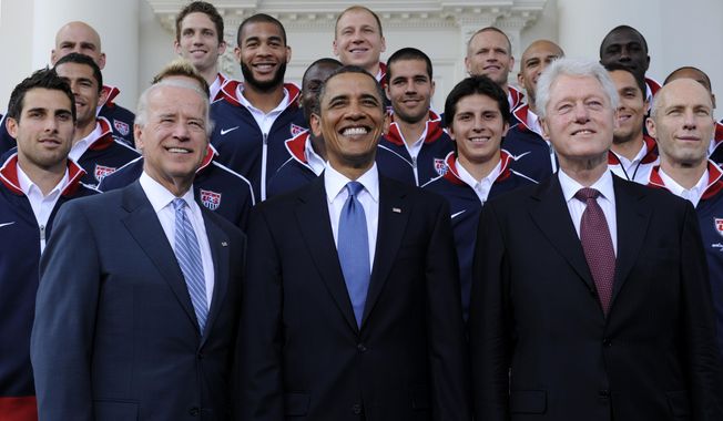 President Barack Obama, flanked by Vice President Joe Biden, left, and former President Bill Clinton, right, pose for a photo with the U.S. World Cup soccer team under the North Portico of the White House in Washington, May 27, 2010. President Joe Biden will share a stage with Barack Obama and Bill Clinton on Thursday in New York as he raises money for his reelection campaign. It&#x27;s a one-of-a-kind political extravaganza that will showcase decades of Democratic leadership. (AP Photo/Susan Walsh, File)