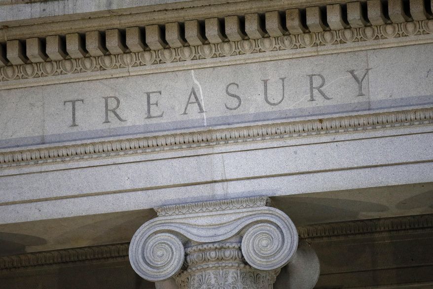 This June 6, 2019, file photo shows the U.S. Treasury Department building at dusk in Washington. (AP Photo/Patrick Semansky, File)