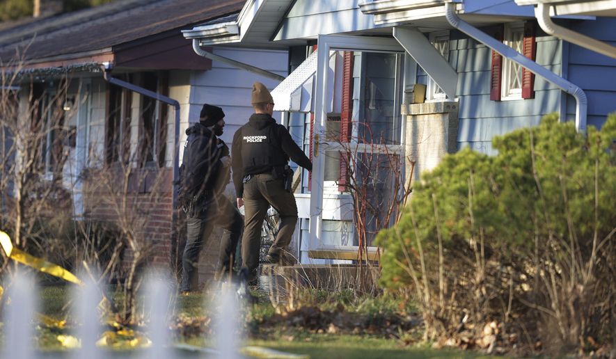 Police investigate stabbings that left several people dead and others injured, Wednesday, March 27, 2024, in Rockford, Ill. A 22-year-old man is in police custody and was being questioned Wednesday afternoon, according to Rockford Police Chief Carla Redd. (Stacey Wescott/Chicago Tribune via AP)
