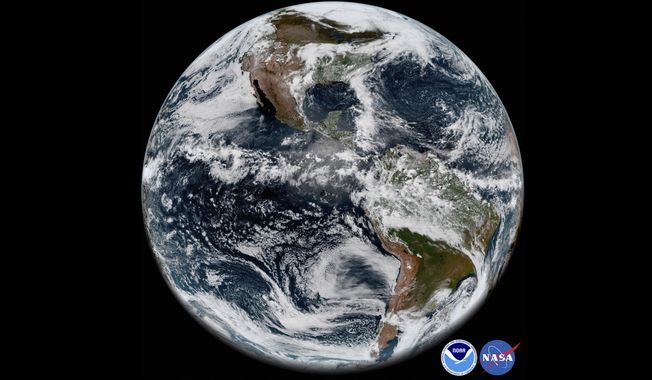 FILE - This image provided by NOAA/NASA In This May 31, 2018 satellite image shows the Earth&#x27;s western hemisphere at 12:00 p.m. EDT on May 20, 2018, made by the new GOES-17 satellite, using the Advanced Baseline Imager (ABI) instrument. For the first time in history, world timekeepers may have to consider subtracting a second from our clocks in a few years because the planet is rotating a tad faster. (NOAA/NASA via AP, File)