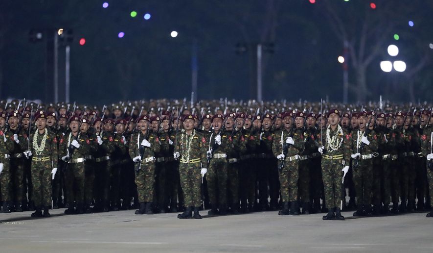 Military officers shout slogans during a parade to commemorate Myanmar&#x27;s 79th Armed Forces Day, in Naypyitaw, Myanmar, Wednesday, March 27, 2024. (AP Photo/Thein Zaw) ** FILE **