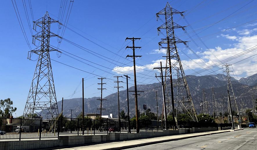 Electrical grid towers are seen during a heat wave where temperature reached 105 degrees Fahrenheit, in Pasadena, Calif., on Aug. 31, 2022. On Wednesday, March 27, 2024, California regulators released a proposal that would change how utility bills are calculated. Regulators say this could help control price spikes during the hot summer months. (AP Photo/John Antczak, File)