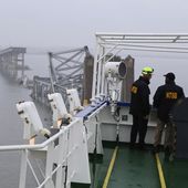 In this image released by the National Transportation and Safety Board, NTSB investigators on the cargo vessel Dali, which struck and collapsed the Francis Scott Key Bridge, Wednesday, March 27, 2024 in Baltimore. (Peter Knudson/NTSB via AP)
