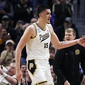 Purdue center Zach Edey (15) is greeted by guard Lance Jones (55) as he heads to the bench during the second half of a Sweet 16 college basketball game against Gonzaga in the NCAA Tournament, Friday, March 29, 2024, in Detroit. (AP Photo/Duane Burleson)