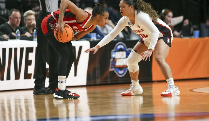 North Carolina State guard Aziaha James, left, looks to get around the defense of Stanford guard Talana Lepolo during the first half of a Sweet 16 college basketball game in the women&#x27;s NCAA Tournament, Friday, March 29, 2024, in Portland, Ore. (AP Photo/Howard Lao)