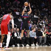 Detroit Pistons guard Evan Fournier (31) shoots against Washington Wizards guard Jordan Poole, right, and forward Kyle Kuzma (33) during the first half of an NBA basketball game Friday, March 29, 2024, in Washington. (AP Photo/Nick Wass)
