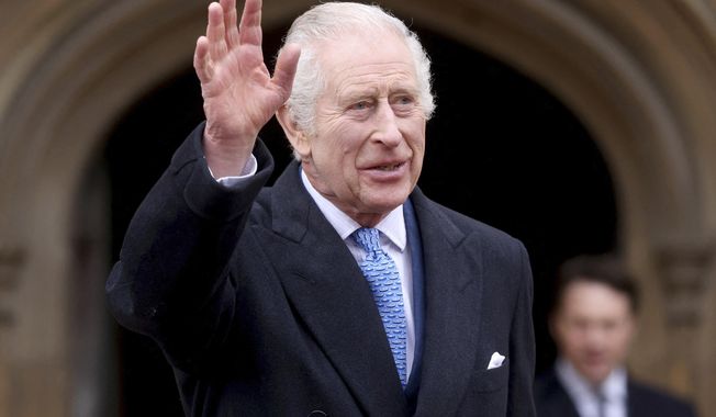 Britain&#x27;s King Charles III waves as he leaves after attending the Easter Matins Service at St. George&#x27;s Chapel, Windsor Castle, England, Sunday, March 31, 2024. (Hollie Adams/Pool Photo via AP)