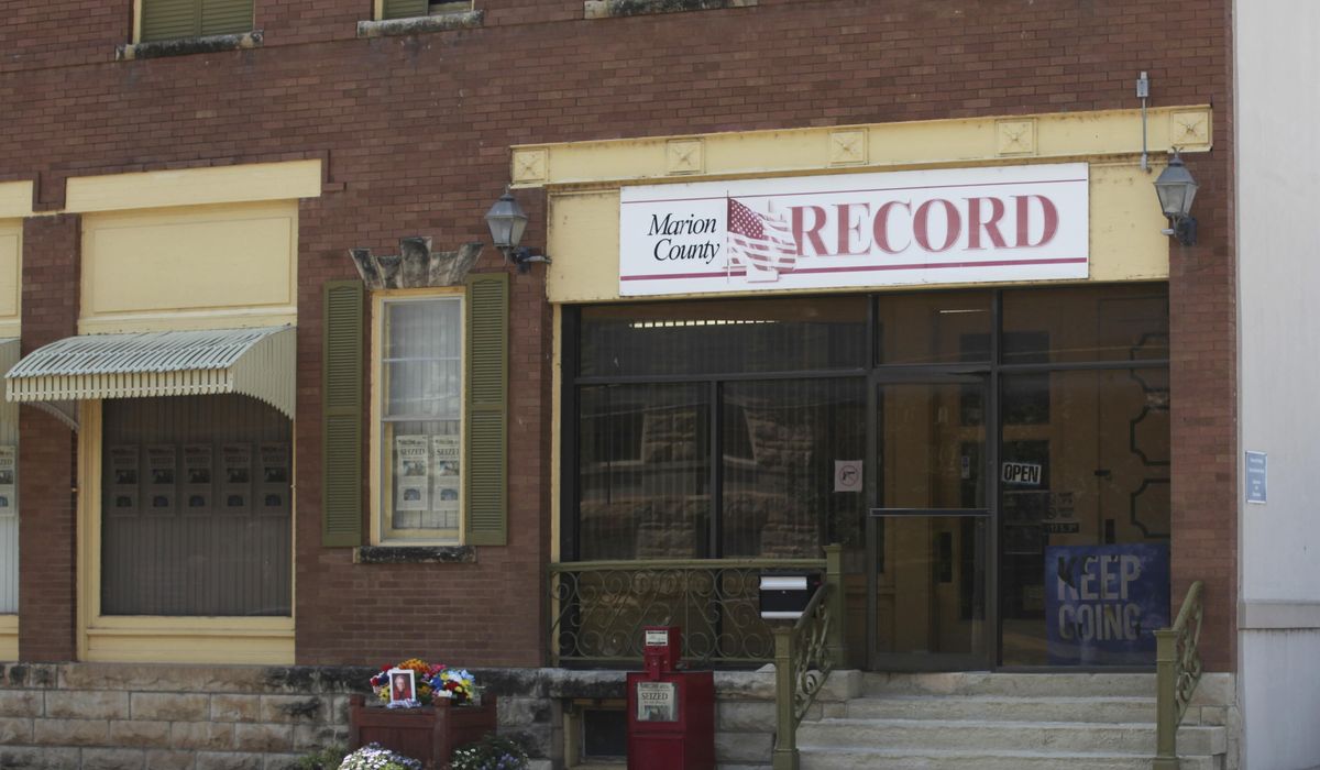 NextImg:A Kansas paper and its publisher are suing over police raids. They say damages exceed $10M