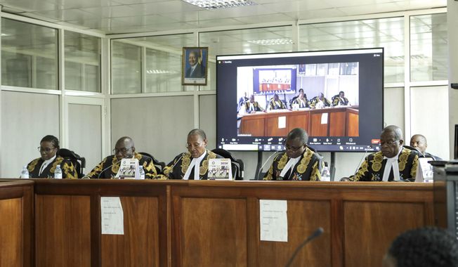 The panel of five judges of the Constitutional Court led by the country&#x27;s chief justice, Richard Buteera, in Kampala, Uganda, Wednesday, April 3, 2024, gives its seal of approval on the anti-homosexuality law, declaring that the Anti Homosexuality Act of 2023 complies with the Constitution of Uganda.(AP Photo/Hajarah Nalwadda )