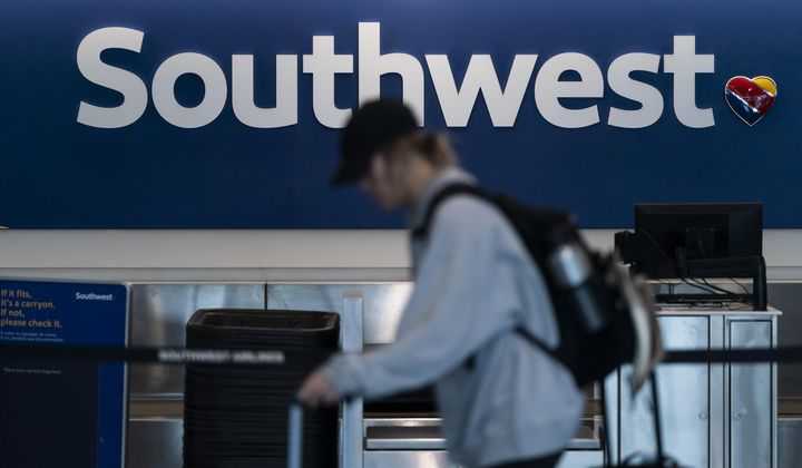 A traveler walks through the Southwest ticketing counter area at the Los Angeles International Airport in Los Angeles, April 18, 2023. (AP Photo/Jae C. Hong, File)