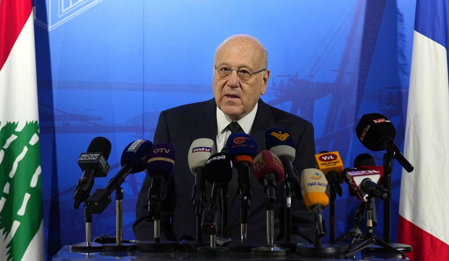 Lebanese caretaker Prime Minister Najib Mikati speaks during a conference announcing a French reconstruction plan for the Beirut Port, in Beirut, Lebanon, Wednesday, March 13, 2024. Mikati has denied all allegations of money laundering after a complaint was filed in France by two anti-corruption groups this week. The complaint against Najib Mikati was formally filed Tuesday, April 2, 2024, to France’s National Financial Prosecutor’s office by French anti-corruption non-governmental organization Sherpa and the Collective of Victims of Fraudulent and Criminal Practices. (AP Photo/Bilal Hussein, File)