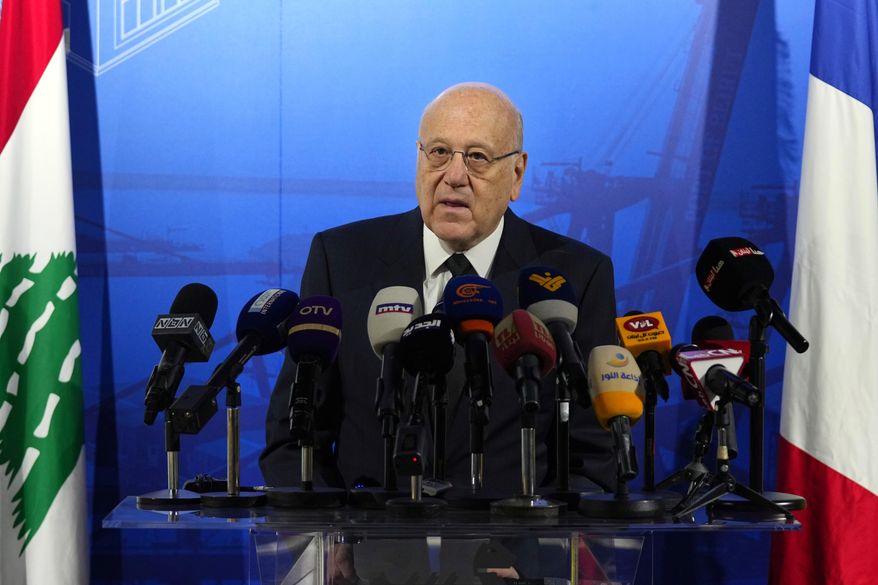 Lebanese caretaker Prime Minister Najib Mikati speaks during a conference announcing a French reconstruction plan for the Beirut Port, in Beirut, Lebanon, Wednesday, March 13, 2024. Mikati has denied all allegations of money laundering after a complaint was filed in France by two anti-corruption groups this week. The complaint against Najib Mikati was formally filed Tuesday, April 2, 2024, to France’s National Financial Prosecutor’s office by French anti-corruption non-governmental organization Sherpa and the Collective of Victims of Fraudulent and Criminal Practices. (AP Photo/Bilal Hussein, File)