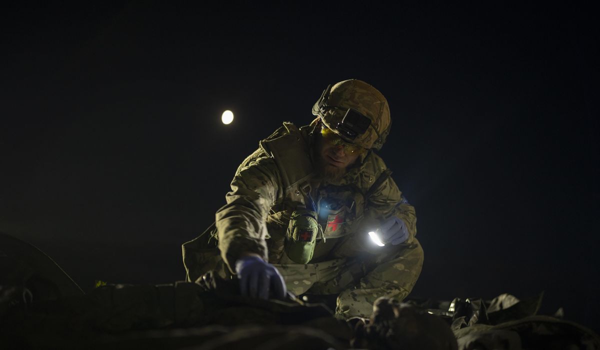 NextImg:The true toll of the war in Ukraine is measured in bodies. This man brings them home, one at a time