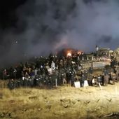 In this Nov. 20, 2016 file photo, provided by Morton County Sheriff&#x27;s Department, law enforcement and protesters clash near the site of the Dakota Access pipeline on Sunday, Nov. 20, 2016, in Cannon Ball, N.D. A federal judge in North Dakota has dismissed the excessive-force lawsuit of a New York woman who was injured in an explosion during the protests of the Dakota Access oil pipeline. (Morton County Sheriff&#x27;s Department via AP) **FILE**