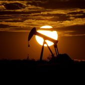The sun sets behind an idle pump jack near Karnes City, Texas, April 8, 2020. The U.S. Securities and Exchange Commission paused on Thursday, April 4, 2024, the implementation of its new climate disclosure rule while it defends the regulation in court. (AP Photo/Eric Gay, File)