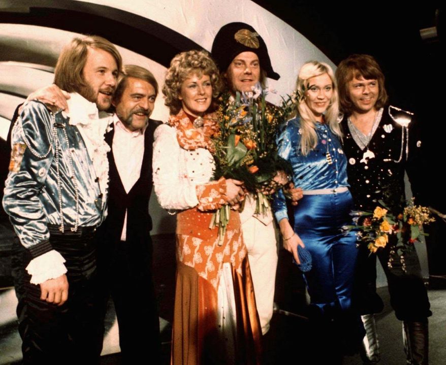 Members of Swedish group ABBA and close associates celebrate the victory of their song "Waterloo" in the Eurovision Song Contest in Brighton, England, April 6, 1974. Fans are celebrating 50 years since ABBA won its first big battle with “Waterloo.” A half century ago on Saturday, April 6, the Swedish quartet triumphed at the 1974 Eurovision Song Contest with the peppy love song. (AP Photo/File)