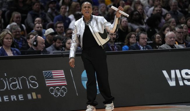South Carolina head coach Dawn Staley reacts to a call during the first half of the Final Four college basketball championship game against Iowa in the women&#x27;s NCAA Tournament, Sunday, April 7, 2024, in Cleveland. (AP Photo/Carolyn Kaster)