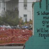 A painted bible verse is seen inside of what is left of a building on March 22, 2024, that was destroyed by a deadly tornado in March 2023 in Rolling Fork, Miss. One year after the deadly tornado struck, buildings throughout town remain boarded up, and the remnants of destroyed properties dot the landscape. The tornado killed 14 residents and reduced the town to rubble as it charted a merciless path across one of the country’s poorest regions. (AP Photo/Rogelio V. Solis)