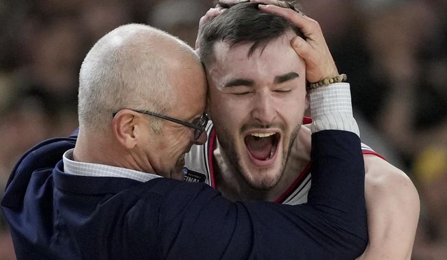 UConn head coach Dan Hurley celebrates with forward Alex Karaban (11) after their win against Purdue in the NCAA college Final Four championship basketball game, Monday, April 8, 2024, in Glendale, Ariz. (AP Photo/David J. Phillip)
