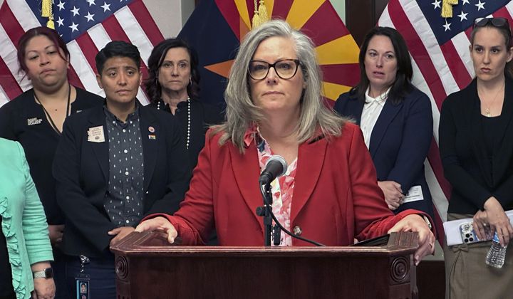 Arizona Gov. Katie Hobbs speaks to reporters at the state Capitol in Phoenix on Tuesday, April 9, 2024. (AP Photo/Jonathan Copper)