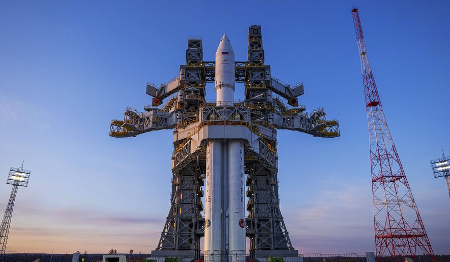 In this photo released by Roscosmos space corporation on Wednesday, April 3, 2024 an Angara-A5 rocket is seen during preparation for the launch at Vostochny space launch facility outside the city of Tsiolkovsky, about 200 kilometers (125 miles) from the city of Blagoveshchensk in the far eastern Amur region, Russia. The Angara-A5 is a new heavy-lift rocket developed in Russia. (Roscosmos space corporation via AP)