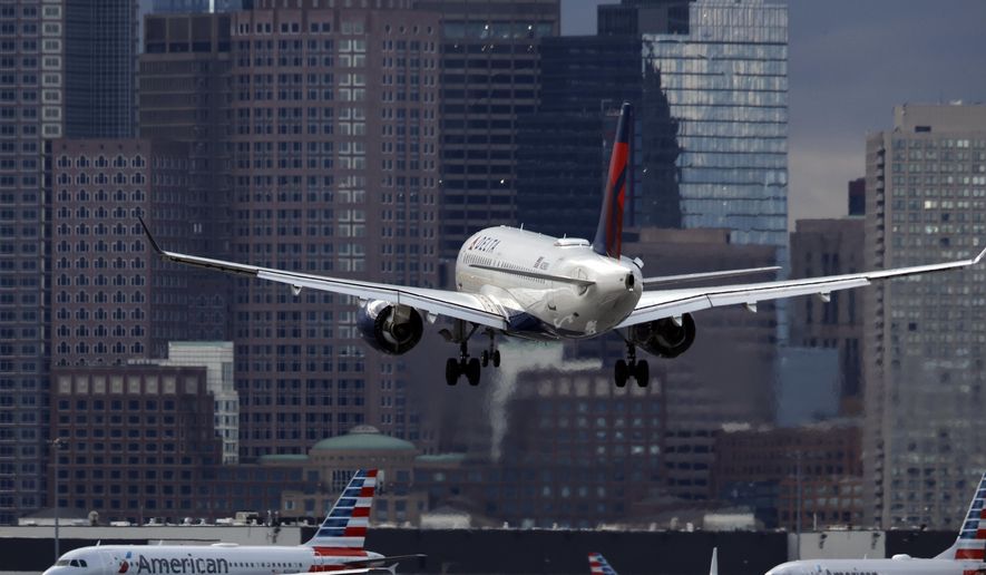 A Delta Air Lines plane lands at Logan International Airport, Jan. 26, 2023, in Boston. Delta reports earnings on Wednesday, April 10, 2024. (AP Photo/Michael Dwyer, File)