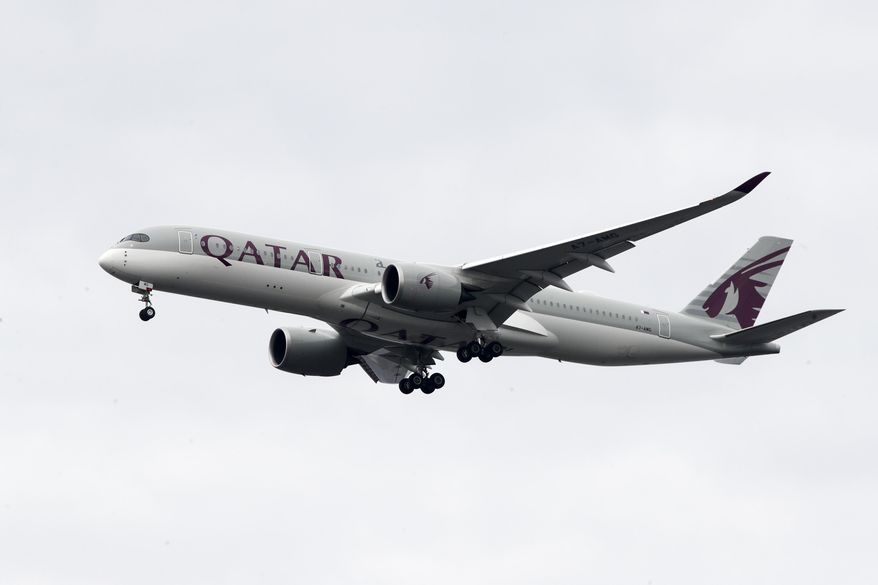 A Qatar Airways jet approaches Philadelphia International Airport in Philadelphia, Nov. 7, 2019. An Australian court on Wednesday, April 10, 2024, has rejected a case brought by five women seeking compensation from Qatar Airways over invasive gynecological examinations conducted on passengers at Doha’s airport in 2020. The women's case against the airport's operator is still going ahead, however. (AP Photo/Matt Rourke, File)