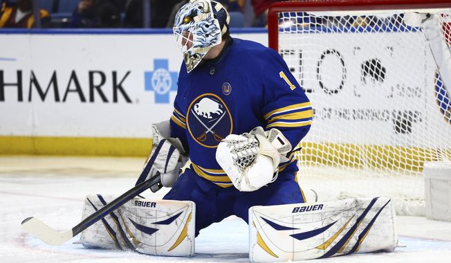 Buffalo Sabres goaltender Ukko-Pekka Luukkonen makes a pad save during the second period of the team&#x27;s NHL hockey game against the Washington Capitals on Thursday, April 11, 2024, in Buffalo, N.Y. (AP Photo/Jeffrey T. Barnes)