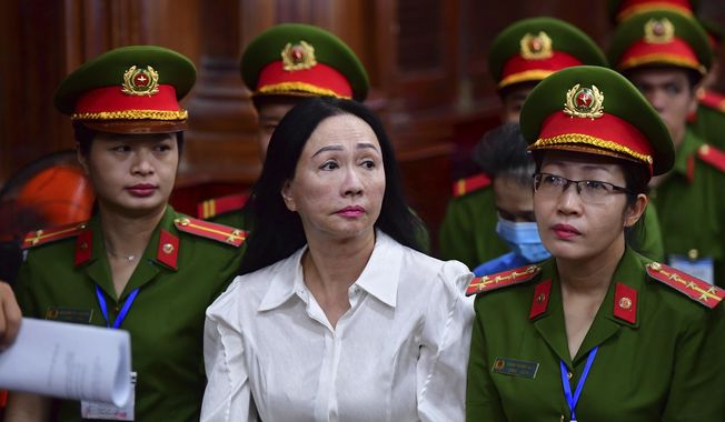 Business woman Truong My Lan, front center, attends a trial in Ho Chi Minh City, Vietnam on Thursday, April 11, 2024. The real estate tycoon may face the death penalty if convicted of allegations that she siphoned off an amount of $12.5 billion, nearly 3 percent of Vietnam&#x27;s 2022 GDP, in its largest financial fraud case. (Thanh Tung/VnExpress via AP)