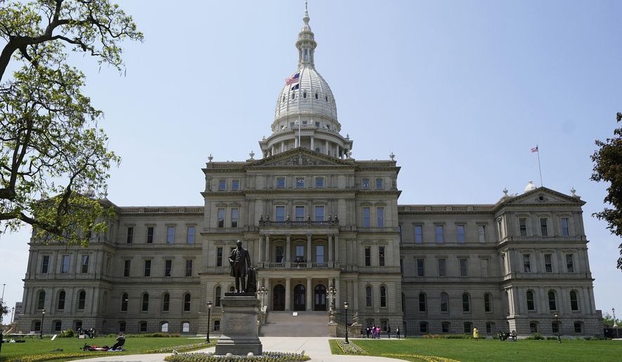 The Michigan State Capitol is photographed, May 24, 2023, in Lansing, Mich. Democrats hope to restore their slim majority in the state House of Representatives Tuesday, April 16, 2024, when voters will fill two vacant seats in suburban Detroit. In District 13, Democrat Mai Xiong faces Republican Ronald Singer. In District 25, Democrat Peter Herzberg faces Republican Josh Powell. The chamber deadlocked at a 54-54 tie in November when two Democratic members won mayoral elections. (AP Photo/Carlos Osorio, File)