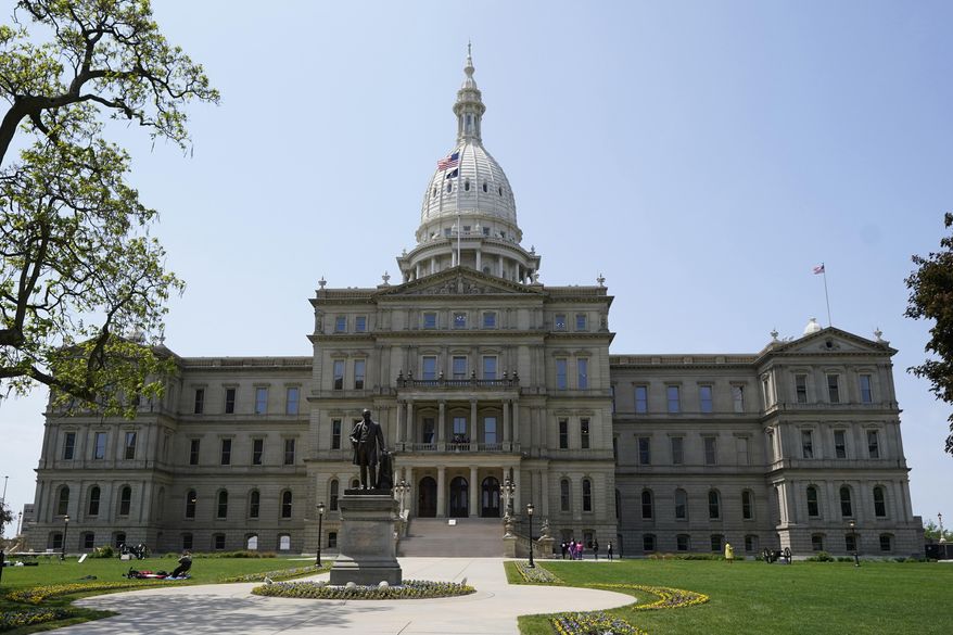 The Michigan State Capitol is photographed, May 24, 2023, in Lansing, Mich. Democrats hope to restore their slim majority in the state House of Representatives Tuesday, April 16, 2024, when voters will fill two vacant seats in suburban Detroit. In District 13, Democrat Mai Xiong faces Republican Ronald Singer. In District 25, Democrat Peter Herzberg faces Republican Josh Powell. The chamber deadlocked at a 54-54 tie in November when two Democratic members won mayoral elections. (AP Photo/Carlos Osorio, File)
