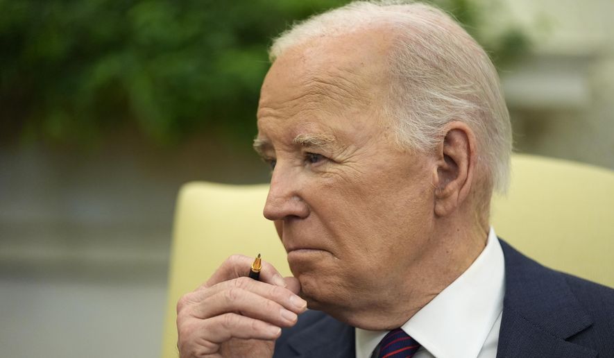 President Joe Biden listens during a meeting with Iraq&#x27;s Prime Minister Shia al-Sudani in the Oval Office of the White House, Monday, April 15, 2024, in Washington. (AP Photo/Alex Brandon)
