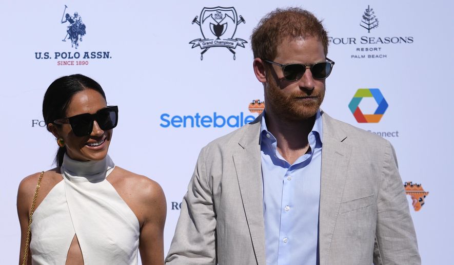 Britain&#x27;s Prince Harry, right, and wife Meghan Markle, Duchess of Sussex, arrive for the 2024 Royal Salute Polo Challenge to Benefit Sentebale, on April 12, 2024, in Wellington, Fla. Prince Harry’s fight for police protection in the U.K. has received another setback. A judge on Monday, April 15, 2024 rejected his request to appeal an earlier ruling upholding a government panel’s decision to limit his access to publicly funded security after he quit as a working member of the royal family. (AP Photo/Rebecca Blackwell, File)