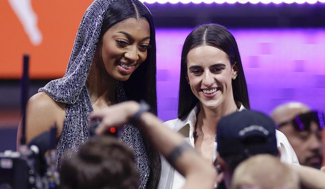 LSU&#x27;s Angel Reese, left, and Iowa&#x27;s Caitlin Clark, right, pose for a photo before the WNBA basketball draft, Monday, April 15, 2024, in New York. (AP Photo/Adam Hunger)