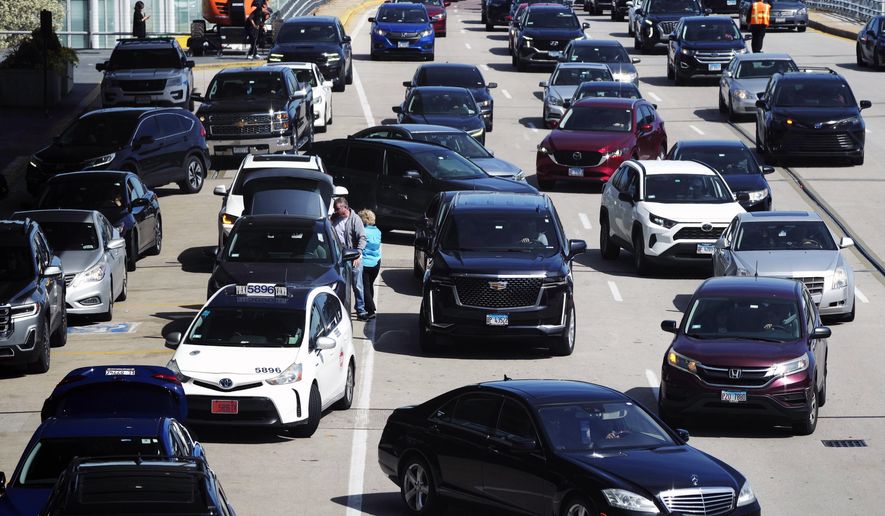 Heavy traffic is seen at O'Hare International Airport in Chicago, Monday, April 15, 2024. Pro-Palestinian demonstrators blocked a freeway leading to three Chicago O'Hare International Airport terminals Monday morning, temporarily stopping vehicle traffic into one of the nation's busiest airports and causing headaches for travelers. (AP Photo/Nam Y. Huh)