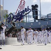 Los Angeles Dodgers and Washington Nationals team members arrive to celebrate Jackie Robinson Tribute Day before a baseball game at Dodgers Stadium in Los Angeles on Monday, April 15, 2024. (AP Photo/Damian Dovarganes)