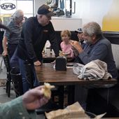 Former Maryland Gov. Larry Hogan, center, talks with patrons of DePaola&#x27;s Bagel and Brunch in Stevensville, Md., Friday, April 12, 2024, as he campaigns for the U.S. Senate. (AP Photo/Susan Walsh)