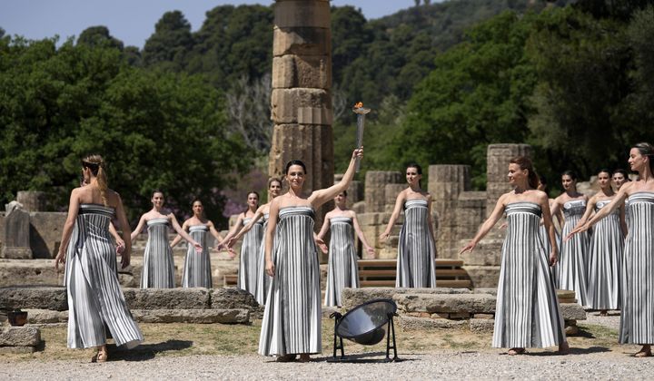 Performers take part in the final dress rehearsal of the flame lighting ceremony for the Paris Olympics, at the Ancient Olympia site, Greece, Monday, April 15, 2024. The flame for the Paris Olympics will be officially lit Tuesday at the birthplace of the ancient games, and will then be carried through Greece for 11 days before being handed over to Paris organizers on April 26. (AP Photo/Thanassis Stavrakis)