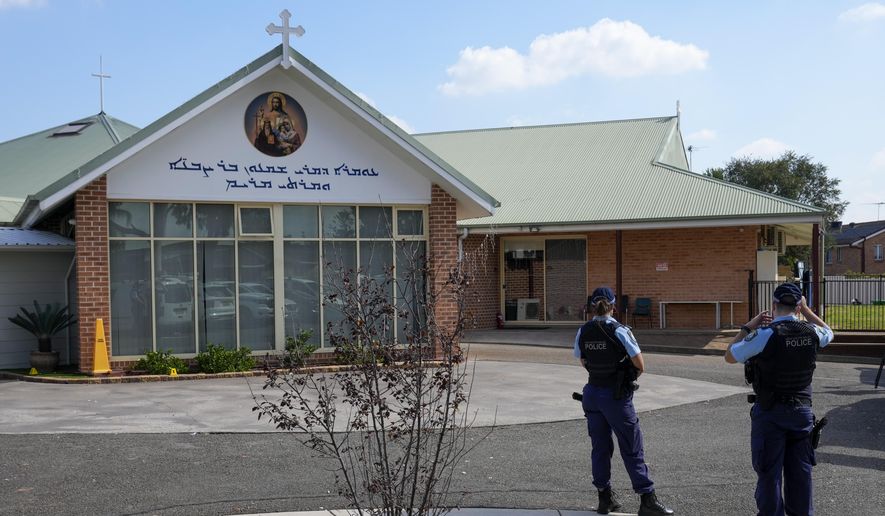 Police patrol outside the Christ the Good Shepherd church in suburban Wakely in western Sydney, Australia, Tuesday, April 16, 2024. Australian police say a knife attack in Sydney that wounded a bishop and a priest during a church service as horrified worshippers watched online and in person, and sparked a riot was an act of terrorism.(AP Photo/Mark Baker)