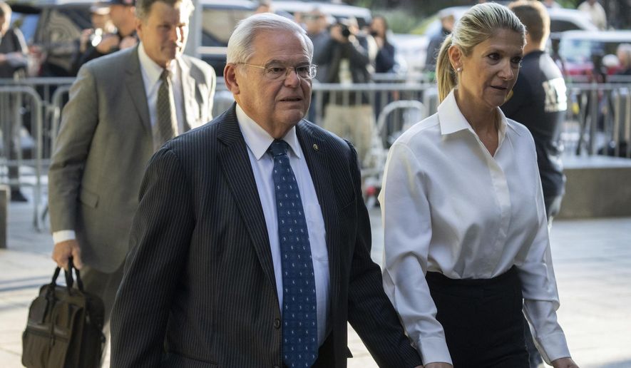 Democratic U.S. Sen. Bob Menendez of New Jersey, left, and his wife, Nadine Menendez, arrive at the federal courthouse in New York, Sept. 27, 2023. Menendez may seek exoneration at his May 2024 bribery trial by blaming his wife, saying she kept him in the dark about anything that could be illegal about her dealings with New Jersey businessmen, according to court papers unsealed Tuesday, April 16, 2024. (AP Photo/Jeenah Moon, File)
