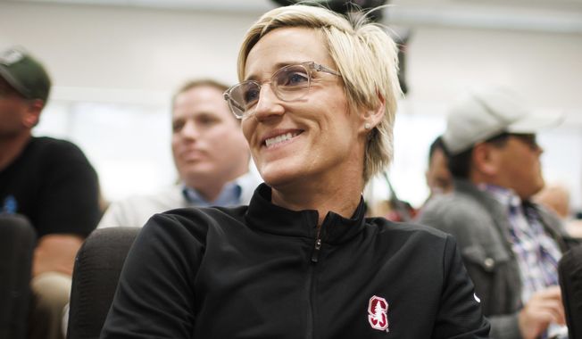 Stanford associate head coach Kate Paye listens to VanDerveer during a news conference in Stanford, Calif., Wednesday, April 10, 2024. VanDerveer, the winningest basketball coach in NCAA history, announced her retirement Tuesday night after 38 seasons leading the Stanford women&#x27;s team and 45 years overall. (Dai Sugano/Bay Area News Group via AP)