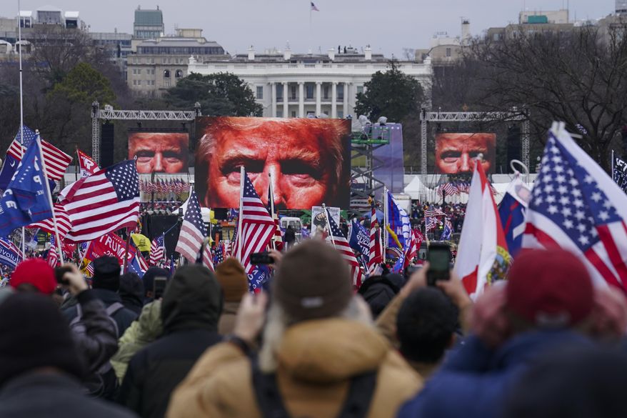 FILE - Supporters of Donald Trump participate in a rally in Washington, Jan. 6, 2021. The Supreme Court is hearing arguments Tuesday, April 16, 2024, over the charge of obstruction of an official proceeding that has been brought against 330 people, according to the Justice Department. The charge refers to the disruption of Congress' certification of Joe Biden's 2020 presidential election victory over former President Trump. Trump faces two obstruction charges. Next week, the justices will weigh whether Trump can be prosecuted at all for his efforts to overturn the 2020 election results. (AP Photo/John Minchillo, File)