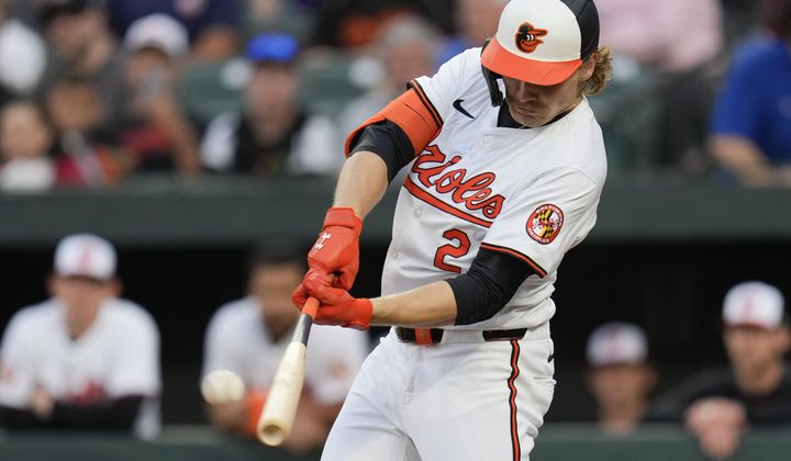 Baltimore Orioles&#x27; Gunnar Henderson hits a home run against the Minnesota Twins during the second inning of a baseball game Tuesday, April 16, 2024, in Baltimore. (AP Photo/Jess Rapfogel)