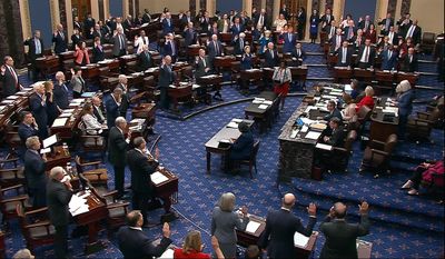 In this image from video from Senate Television, Sen. Patty Murray, D-Wash., swears senators in for the impeachment trial of Homeland Security Secretary Alejandro Mayorkas on the Senate floor at the U.S. Capitol, Wednesday, April 17, 2024, in Washington. (Senate Television via AP)