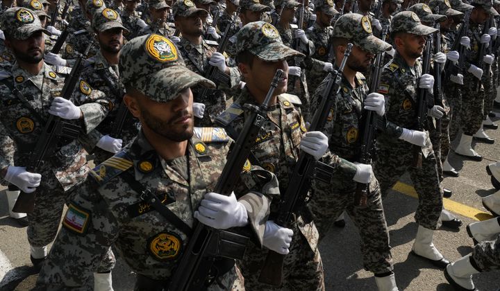 Iranian army members march during Army Day parade at a military base in northern Tehran, Iran, Wednesday, April 17, 2024. In the parade, President Ebrahim Raisi warned that the &quot;tiniest invasion&quot; by Israel would bring a &quot;massive and harsh&quot; response, as the region braces for potential Israeli retaliation after Iran&#x27;s attack over the weekend. (AP Photo/Vahid Salemi)