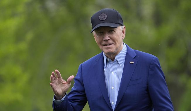 President Joe Biden waves as he walks across the South Lawn of the White House in Washington, Wednesday, April 17, 2024, after returning from a trip to Pennsylvania. (AP Photo/Susan Walsh)